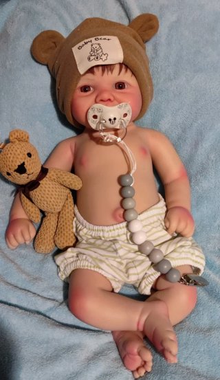 Tierno reborn silicona niño  con pelo caoba