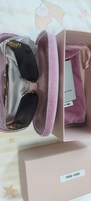 Gafas de sol Miu Miu doradas y grises