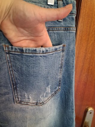 Pantaloni uomo jeans strappati effetto used