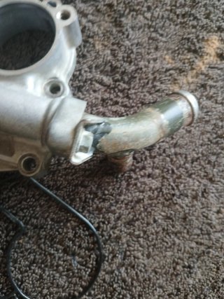 Tapa filtro y bomba agua Suzuki RMZ250