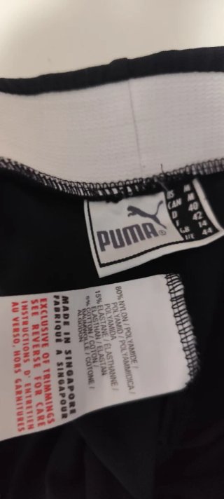 Leggings Puma Negros con Raya Blanca