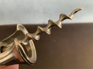 Antico cavatappi a campana aperta