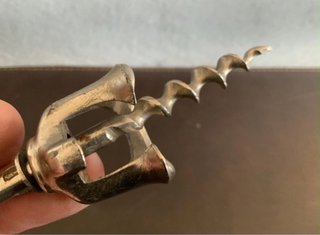 Antico cavatappi a campana aperta