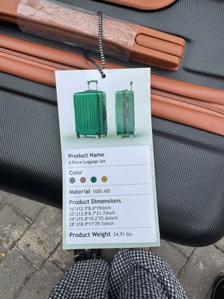 Maleta de viaje negra con detalles marrones