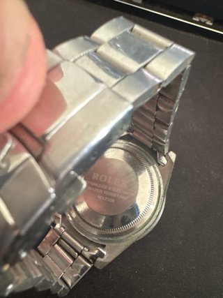 Reloj Rolex submariner negro y plateado.