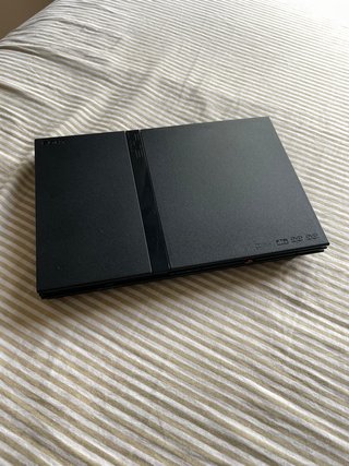 PlayStation 2 Slim +2 mandos + 8 juegos originales