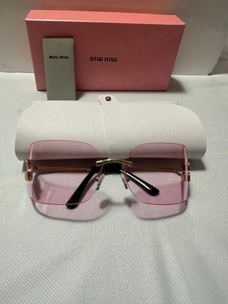 Gafas de sol Miu Miu rosas y doradas
