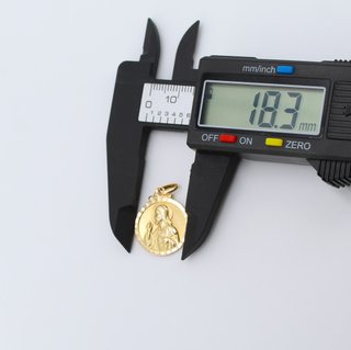 Colgante de oro de 18k. Peso: 2.56 gr.