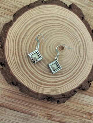 Pendientes plateado y cristal azul.