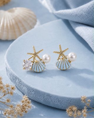 Pendientes dorados estrella mar, concha y perla