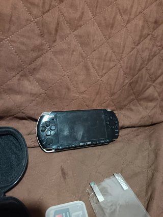 PSP Slim 2000 Negra + Accesorios leer