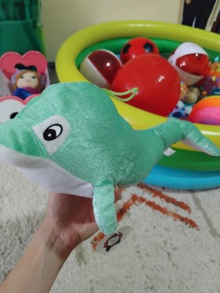 Peluche de delfín verde brillante