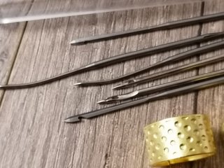 Agujas de coser y dedales