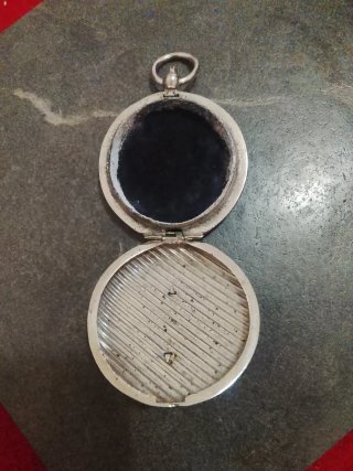 Sello de bolsillo forma de un reloj siglo XX