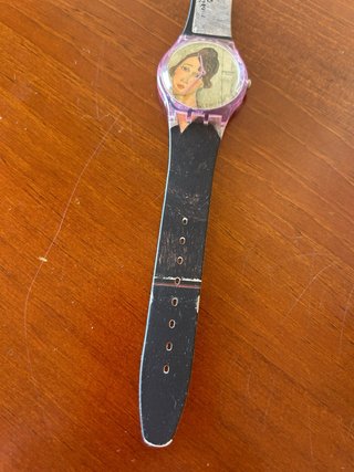 Reloj Swatch con retrato de mujer