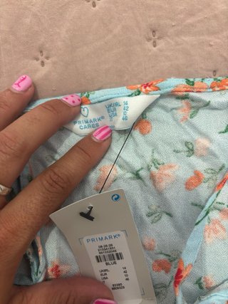 Top floral azul y naranja