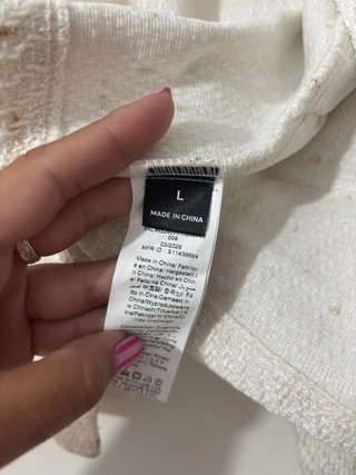 Chaqueta beige con detalles dorados
