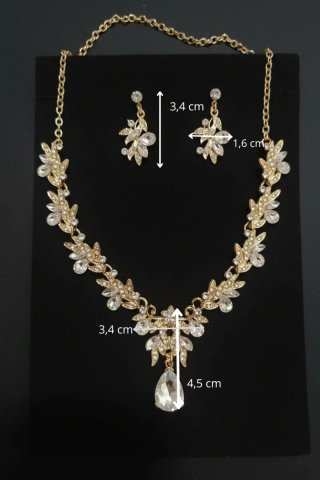 Conjunto de joyas dorado con lágrimas brillantes