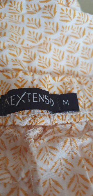Pantalones cortos con estampado y pompón