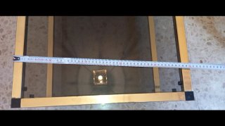Mesa de centro cristal ahumado y metal dorado