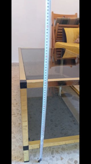 Mesa de centro cristal ahumado y metal dorado