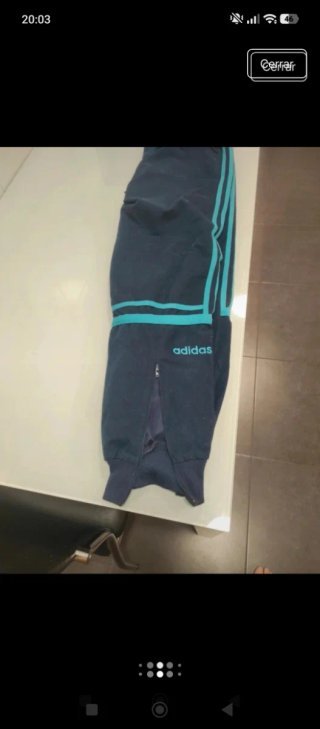 Pantalón Adidas azul con rayas turquesa