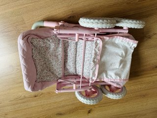 Silla de paseo para muñecas rosa