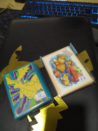 2 Packs Fundas Pokémon TCG Dragonite & Eevee