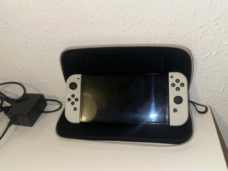 Nintendo Switch OLED + 2 Juegos + SD + funda