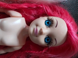 Muñeca 36 cm pelo rosa ojos azules