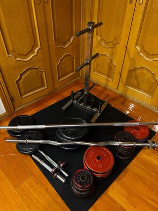 Gimnasio en casa mancuernas barras y discos 136kg