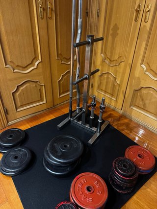 Gimnasio en casa mancuernas barras y discos 136kg