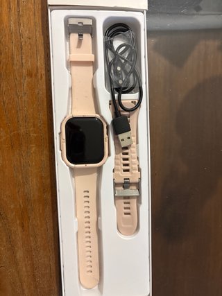 Smartwatch rosa con cargador