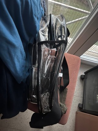 Mochila transparente con bolsillo para pines