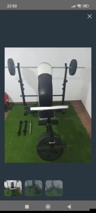 Banco de pesas con barra y discos