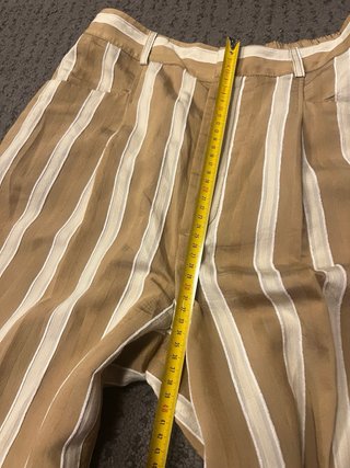 Pantalones anchos de rayas beige y blanco