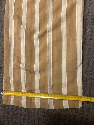 Pantalones anchos de rayas beige y blanco