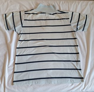 Polo Lacoste azul con rayas azul oscuro