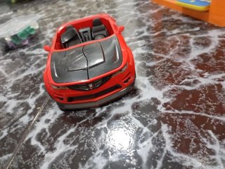 Coche de WWE rojo y ring de WWE