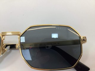 gafas de sol caballero/unisex versace octagonales montura dorada con greca