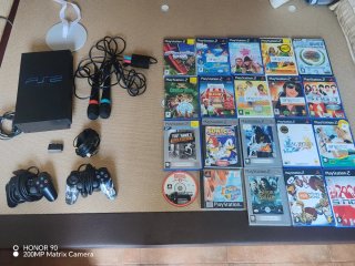 PlayStation 2 con 2 mandos 2 micros y 16 juegos