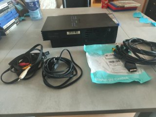 PlayStation 2 con 4 juegos y accesorios