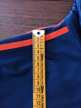 Chaqueta Adidas azul y naranja