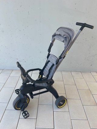 Triciclo Doona Gris
