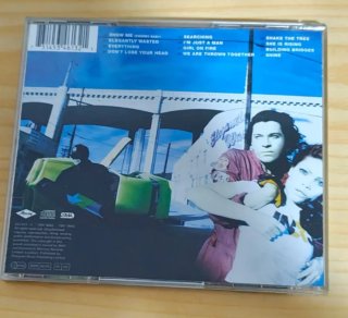 2 CDs INXS "The Greatest Hits" y "Eleganted wasted