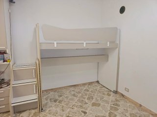 Letto a castello con scaletta e cassetti colombini