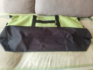 Bolso de viaje Samsonite verde y negro con asas.