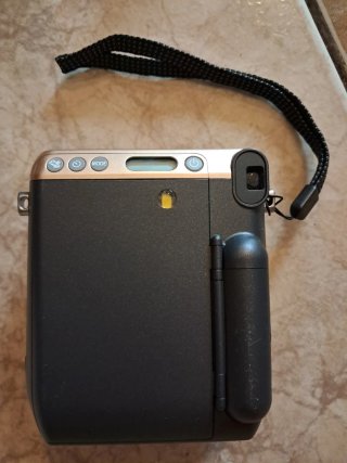 Cámara Instax Mini con funda y película Fujifilm