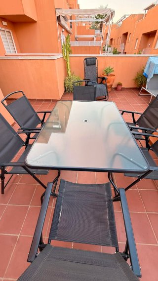 Conjunto mesa cristal y 6 sillones jardín