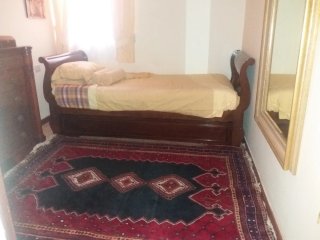 Cama barco nido de caoba con otra cama extraíble.